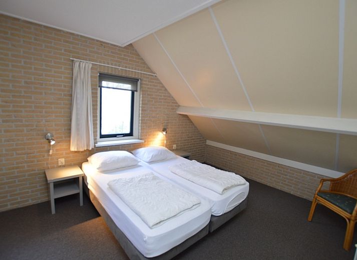 Cozy living room in Holiday home Stappeland 207, De Koog, Texel with comfortable sofas and lots of natural light.