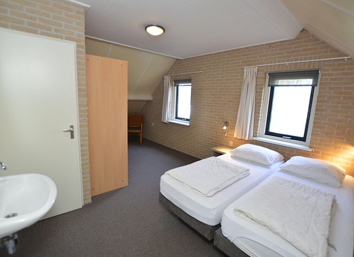 Spacious open kitchen and sitting area in Holiday home Stappeland 207, De Koog, Texel, perfect for family gatherings.