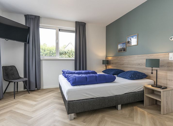 Villa 39 in De Koog, Texel, offers a spacious terrace with modern outdoor space for relaxation on the Wadden Islands.