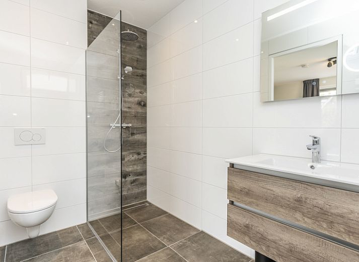 Villa 39 in De Koog, Texel, offers a spacious terrace with modern outdoor space for relaxation on the Wadden Islands.