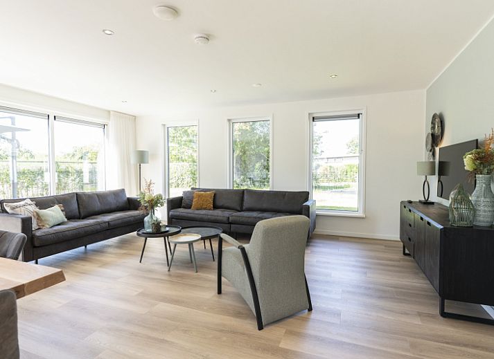 Villa 37a in De Koog, Texel with spacious terrace and green garden, ideal for a vacation home on the Wadden Islands.