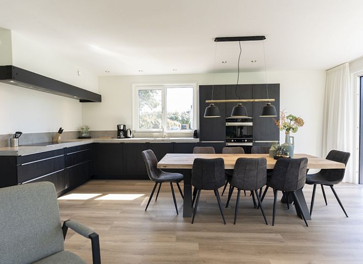 Villa 37a in De Koog, Texel with spacious terrace and green garden, ideal for a vacation home on the Wadden Islands.