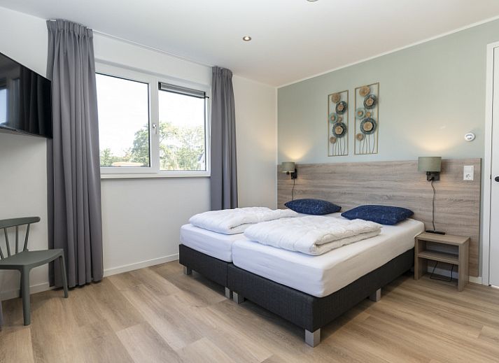 Villa 37a in De Koog, Texel with spacious terrace and green garden, ideal for a vacation home on the Wadden Islands.