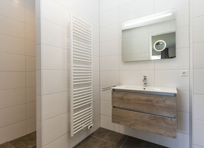 Villa 37a in De Koog, Texel with spacious terrace and green garden, ideal for a vacation home on the Wadden Islands.