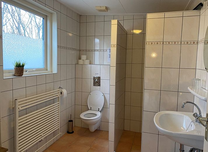 Sunny terrace at Bungalow 51, Bungalowpark 't Luwe Land, De Koog, Texel, ideal for outdoor relaxation.