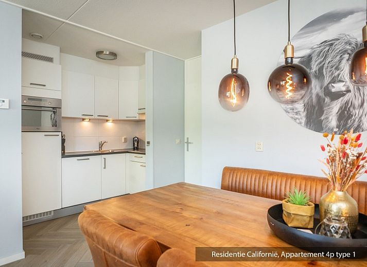Cozy living room in Type 1 vacation home, De Koog, Texel with comfortable sofa and lots of natural light.