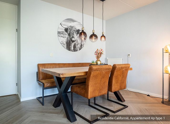 Cozy living room in Type 1 vacation home, De Koog, Texel with comfortable sofa and lots of natural light.