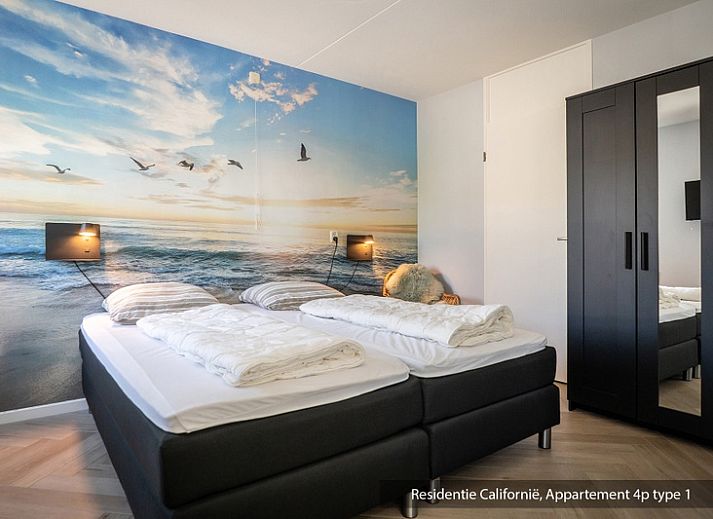 Cozy living room in Type 1 vacation home, De Koog, Texel with comfortable sofa and lots of natural light.