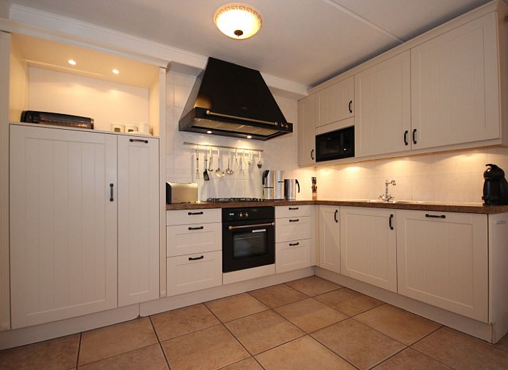 Villa with Conservatory in De Koog, Texel with charming exterior and green surroundings.