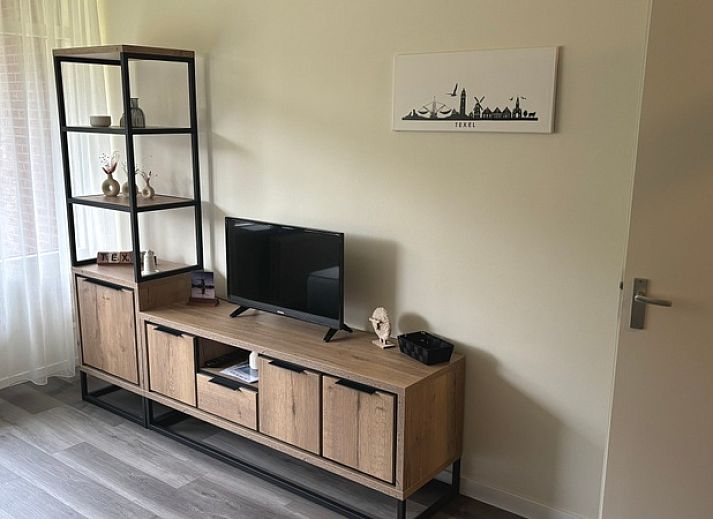 Cozy living room in Apartment Kerckeland 40, De Koog, Texel with a view of nature.