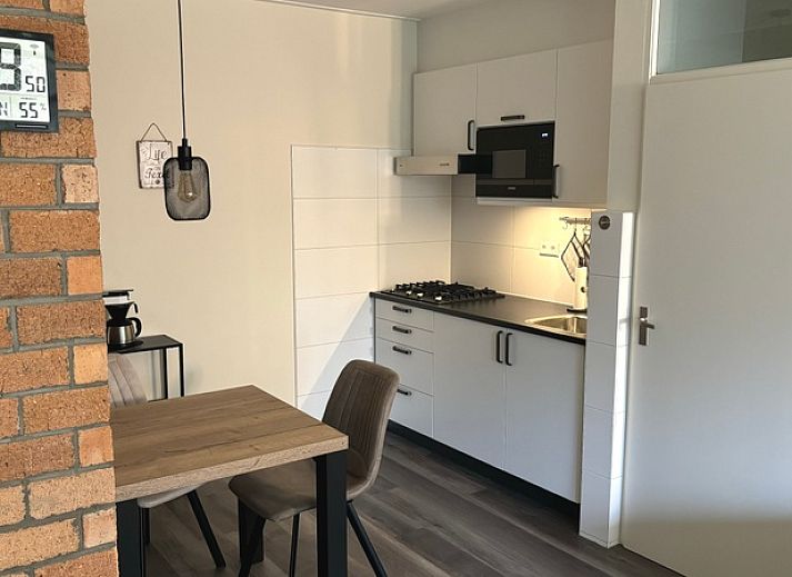 Cozy living room in Apartment Kerckeland 40, De Koog, Texel with a view of nature.
