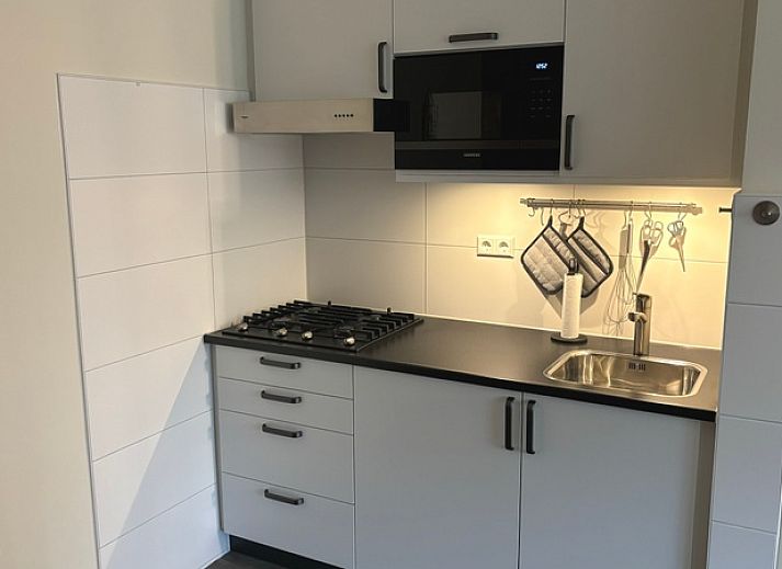 Comfortable sitting area in Apartment Kerckeland 40, De Koog, Texel with green surroundings.