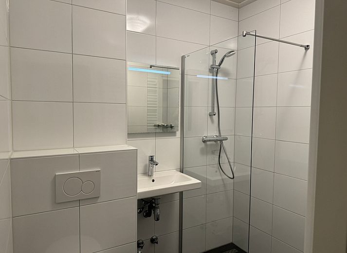 Comfortable sitting area in Apartment Kerckeland 40, De Koog, Texel with green surroundings.