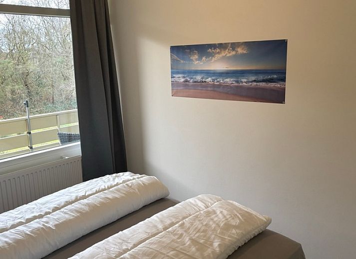Comfortable sitting area in Apartment Kerckeland 40, De Koog, Texel with green surroundings.