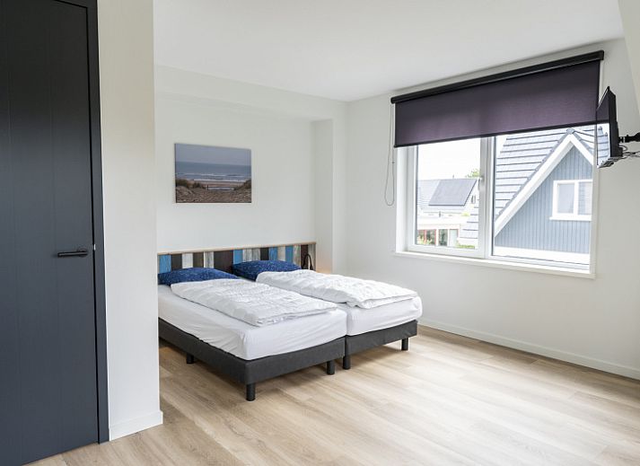 Modern living room of Villa 37, De Koog, Texel. Comfortable seating area in vacation home on the Wadden Islands.