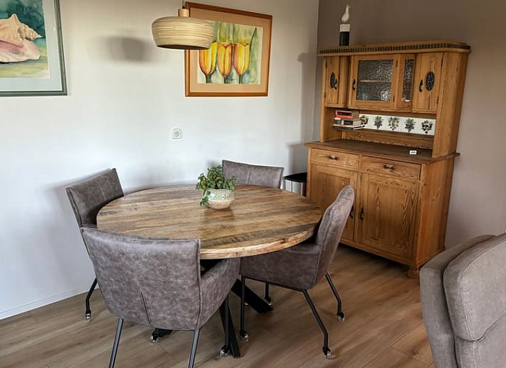 Enjoy the sunny patio at Cottage in De Koog, Texel, with comfortable outdoor furniture and green surroundings.