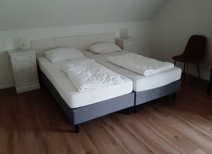 Cozy terrace of Cottage in De Koog on Texel, ideal for relaxing outdoor meals.