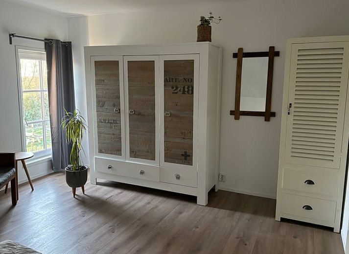 Cozy terrace of Cottage in De Koog on Texel, ideal for relaxing outdoor meals.