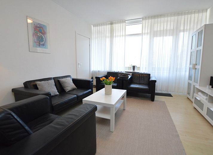 Cozy living room in Apartment Kerckeland 98, De Koog, Texel with comfortable seating and modern furnishings.