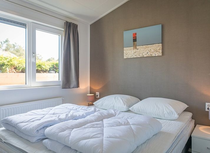 Spacious living room of Chalet Bregkoog 262 in De Koog, Texel, offers comfort and style on the Wadden Islands.