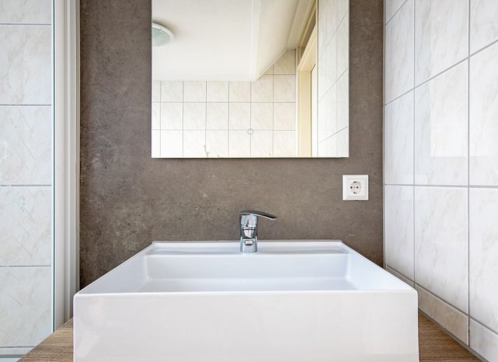 Child-friendly environment at Villa 5, De Koog, Texel, with fun on the go-kart for younger guests.