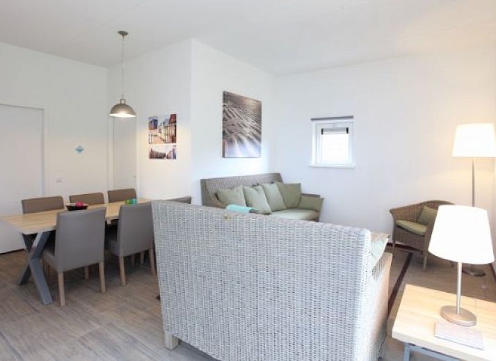 Modern vacation home at Kustpark houses in De Koog, Texel, surrounded by greenery for a relaxing stay on the Wadden Islands.