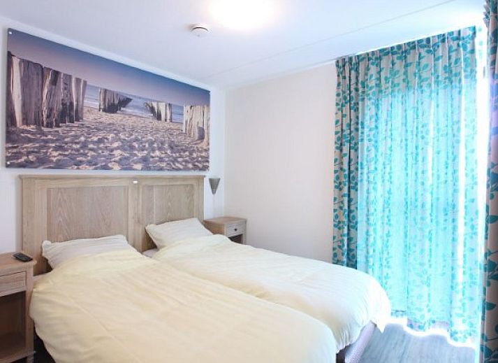 Modern vacation home at Kustpark houses in De Koog, Texel, surrounded by greenery for a relaxing stay on the Wadden Islands.