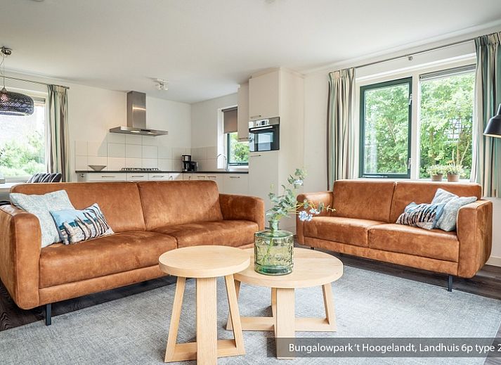 Bungalowpark 't Hoogelandt vacation home in De Koog, Texel with thatched roof and sunny terrace.