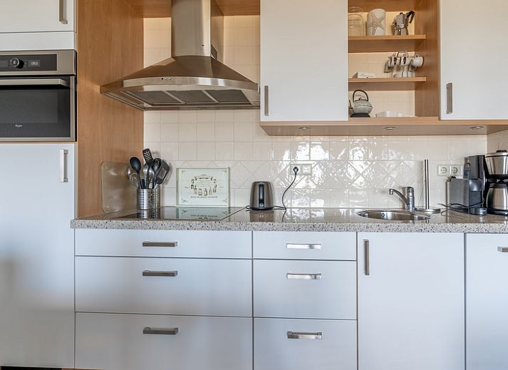 Gemuetliche Sitzecke im Apartment Juliana 116 Zeezicht, De Koog, Texel mit Panoramablick ueber das Wattenmeer.