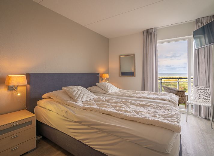 Gemuetliche Sitzecke im Apartment Juliana 116 Zeezicht, De Koog, Texel mit Panoramablick ueber das Wattenmeer.