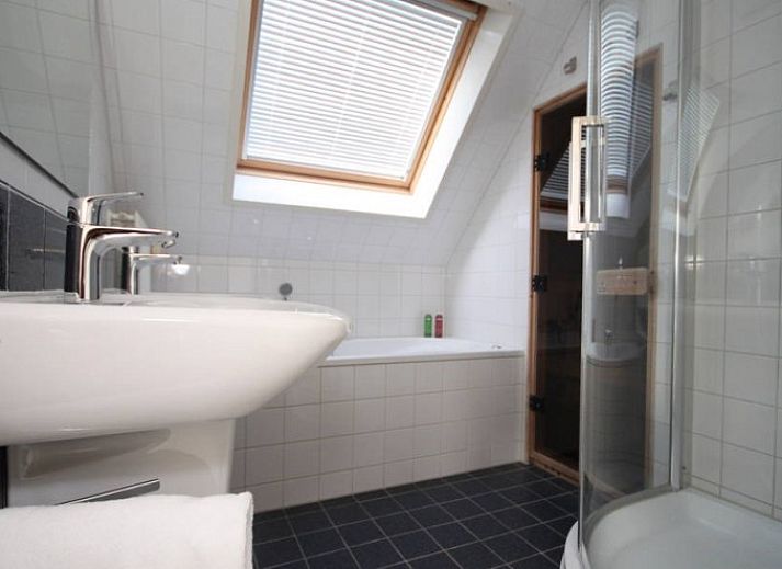 Spacious living room in 6 Person luxury villa, De Koog, Texel with modern furnishings and cozy sitting area.