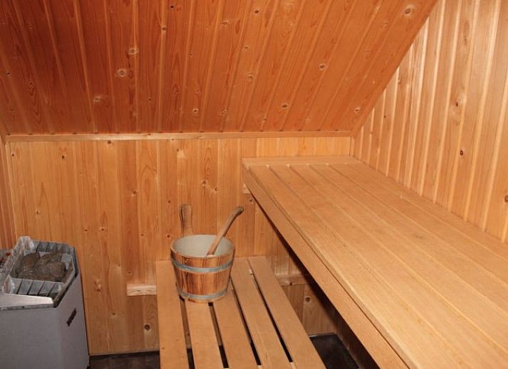 Spacious living room in 6 Person luxury villa, De Koog, Texel with modern furnishings and cozy sitting area.