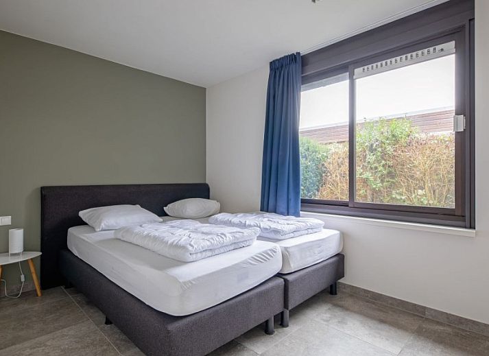 Luchtfoto van Orchismient 20, De Koog, Texel, vakantiehuis in groene omgeving.