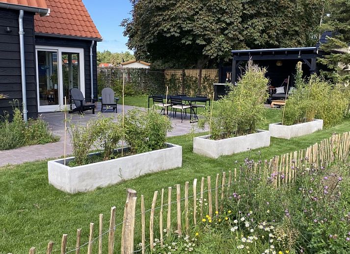 Ruime zitkamer in Paal 234, een vakantiehuis op Texel, De Koog.