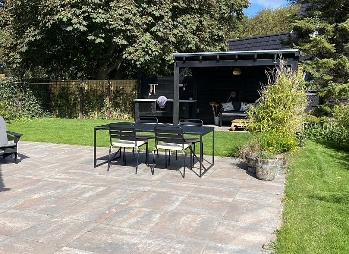 Ruime zitkamer in Paal 234, een vakantiehuis op Texel, De Koog.