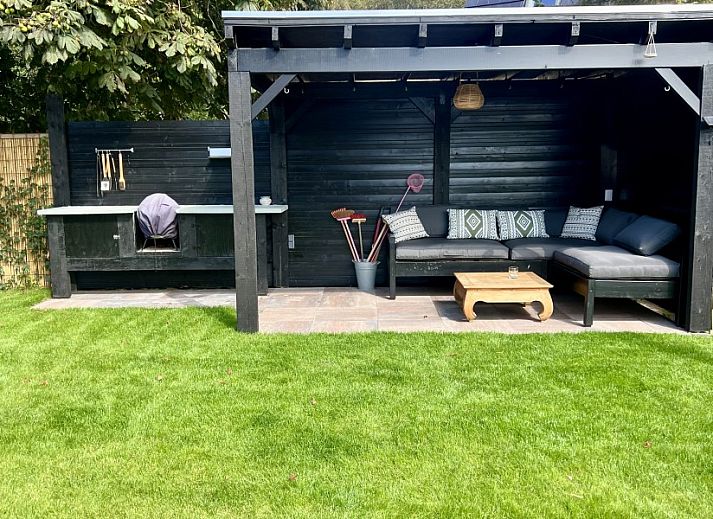 Ruime zitkamer in Paal 234, een vakantiehuis op Texel, De Koog.