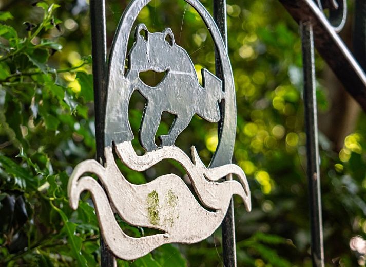 Cozy living room of Koetshuis vacation home in De Koog, Texel, with comfortable sofas and warm decor on the Wadden Islands.