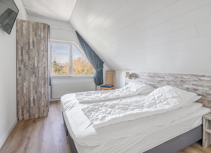 Gemuetliches Wohnzimmer im Ferienhaus Kamperfoelie 97, De Koog, Texel mit viel Licht auf den Watteninseln.