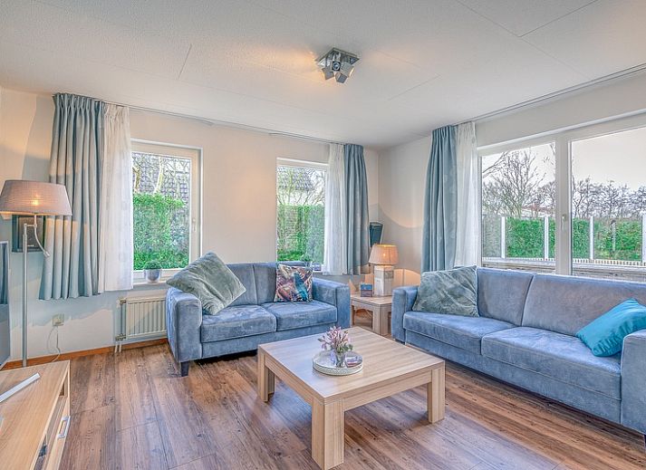 Vacation home Honeysuckle 55 in De Koog Texel overlooking green garden and water feature.