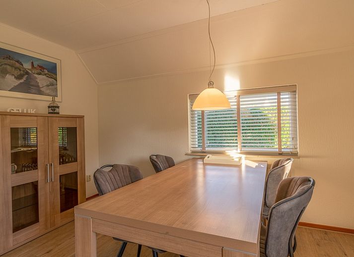 Exterior of Holiday home Honeysuckle 63, De Koog, Texel, surrounded by greenery.