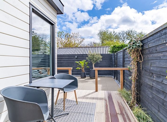 Gemuetliches Wohnzimmer im Appartement Zee van Tijd, De Koog, Texel. Gemuetlicher Innenraum zum Entspannen.