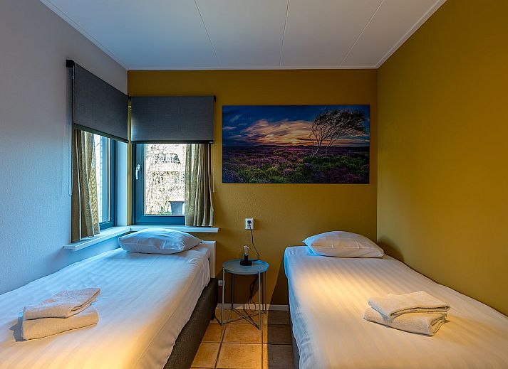 Modern living room of Zilte Bries vacation home, De Koog, Texel, with comfortable seating area.