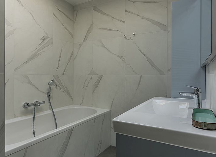 Stylish interior of Zilte Bries vacation home, De Koog, Texel, with art on the wall.