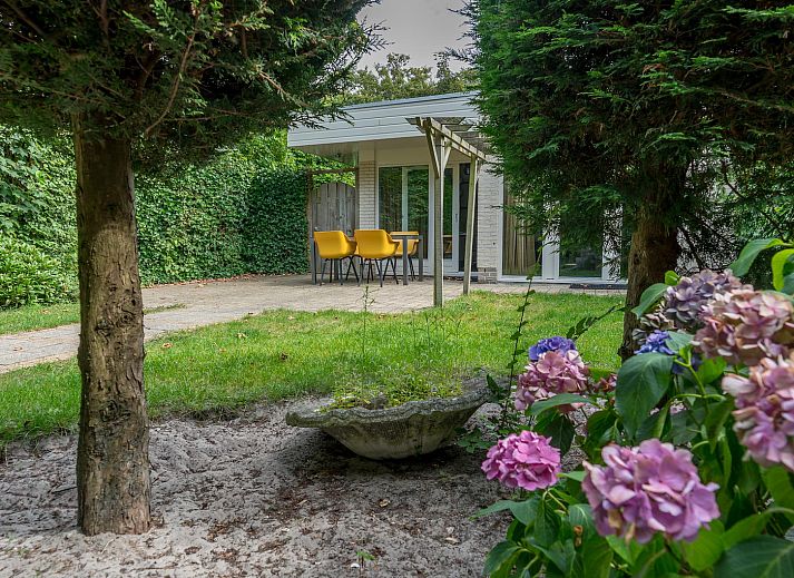 Stylish interior of Zilte Bries vacation home, De Koog, Texel, with art on the wall.