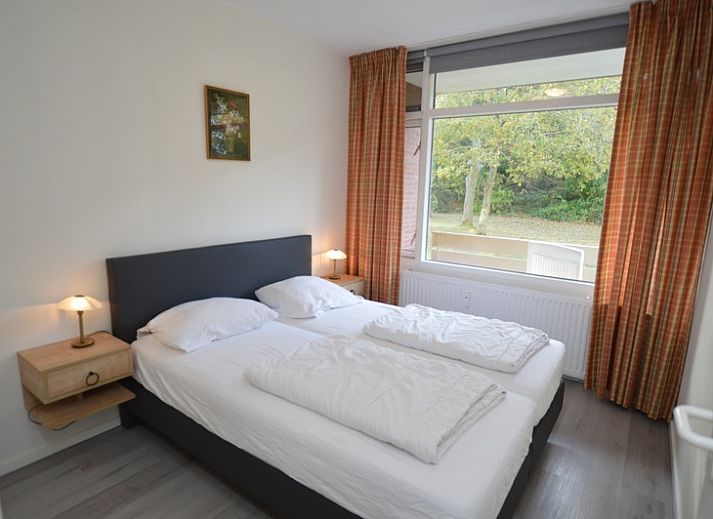 Bright living room of Apartment Kerckeland 20 in De Koog, Texel overlooking the green surroundings.