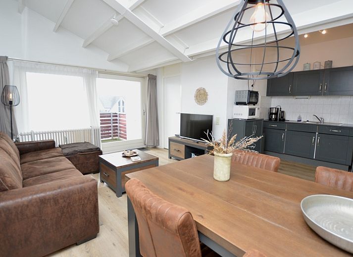 Cozy living room of Motel Texel - Apartment 314/1S in De Koog, Texel, with comfortable seating area.