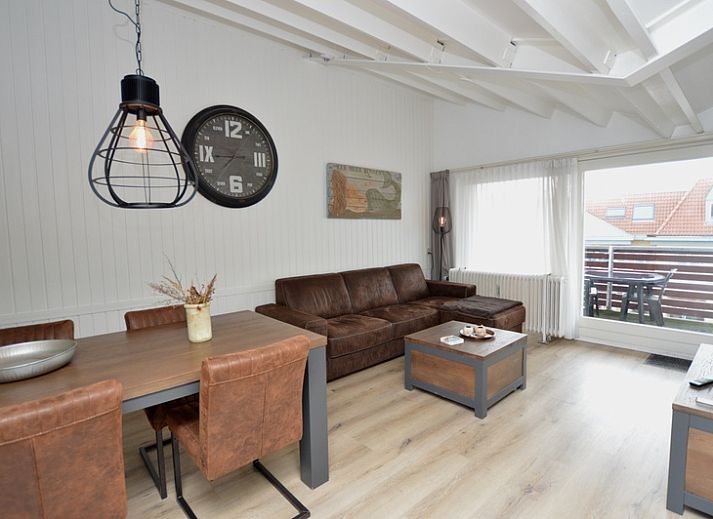 Cozy living room of Motel Texel - Apartment 314/1S in De Koog, Texel, with comfortable seating area.