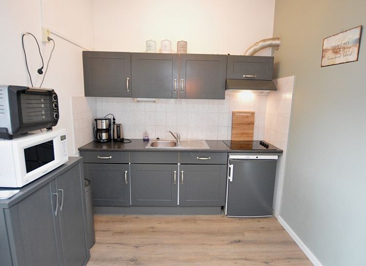Spacious kitchen and dining area in Motel Texel - Apartment 314/1S, De Koog, with modern amenities.