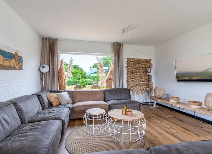 Dining area in Cottage in De Koog, Texel, overlooking green fields, Wadden Islands.