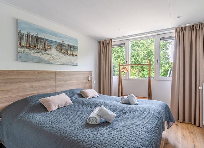Dining area in Cottage in De Koog, Texel, overlooking green fields, Wadden Islands.